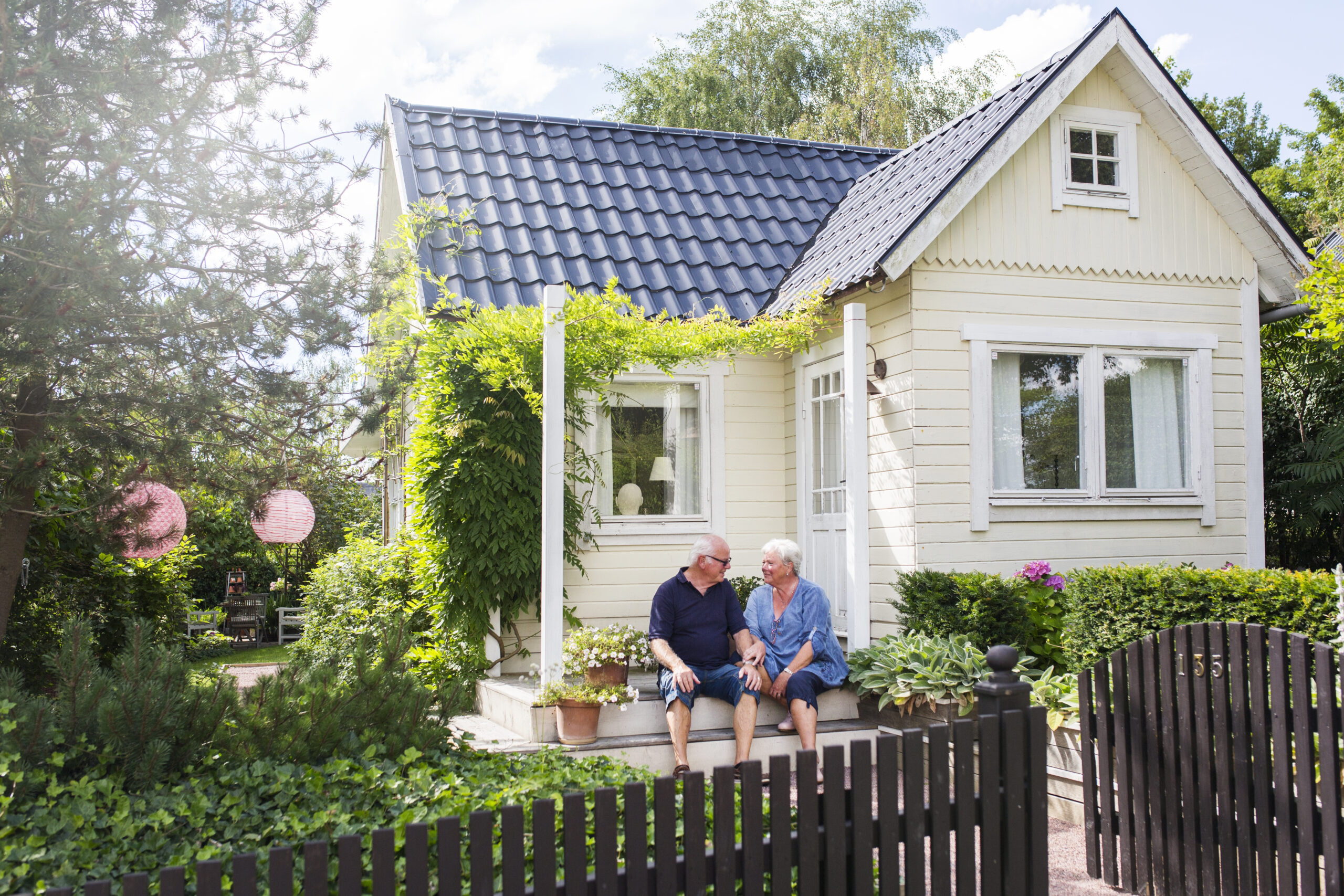 Senior homeowners receiving downsizing transition support from a real estate agent